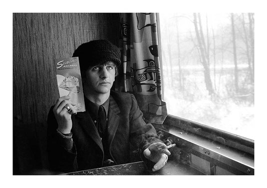 The Beatles - Ringo Starr Holding a Seaboard Railroad Card on the Train After the Ambassador's Party in Washington, February 1964