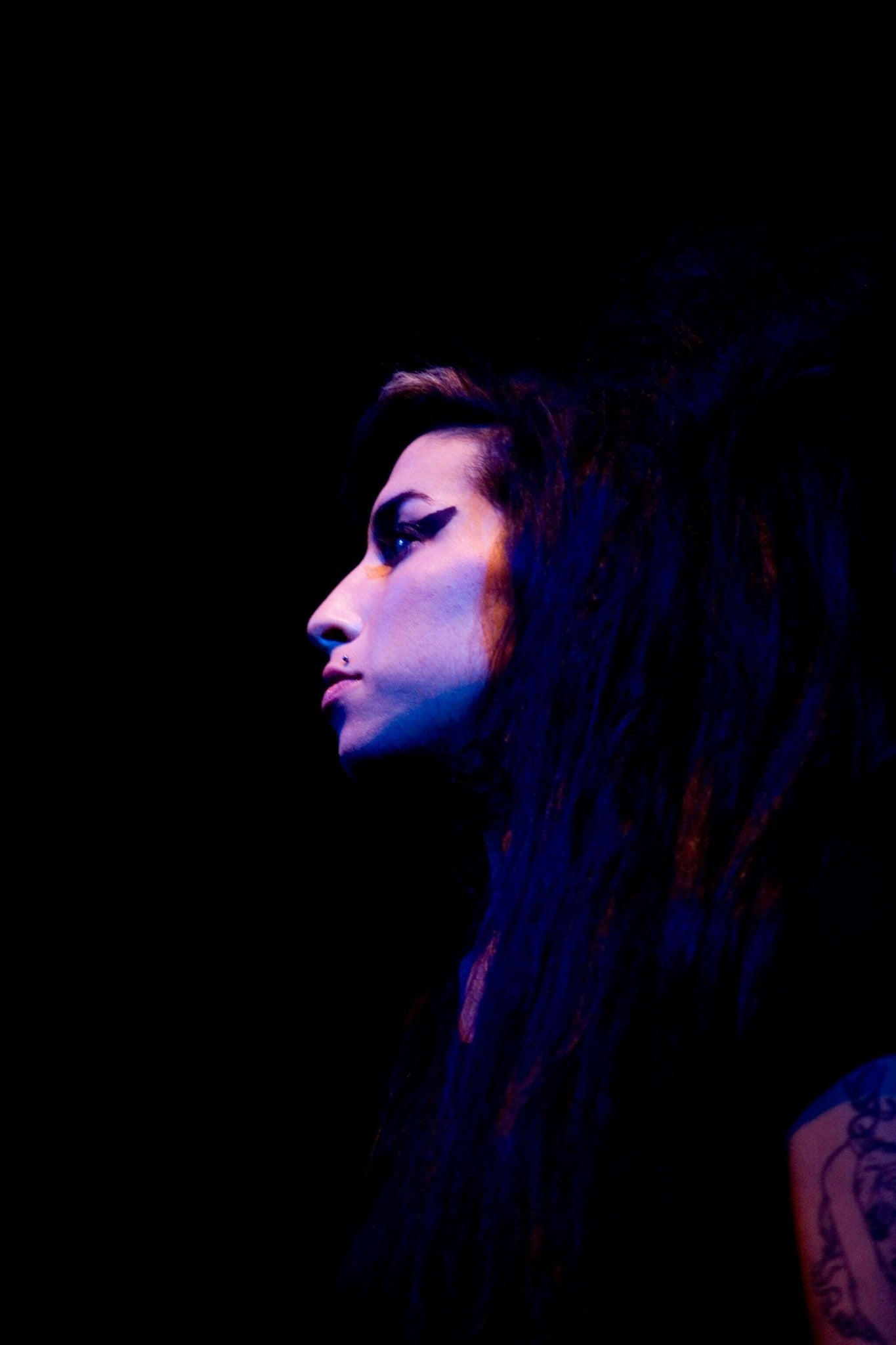 Amy Winehouse - A Profile Portrait Against a Dark Backdrop, 2007 Poster (1/2)