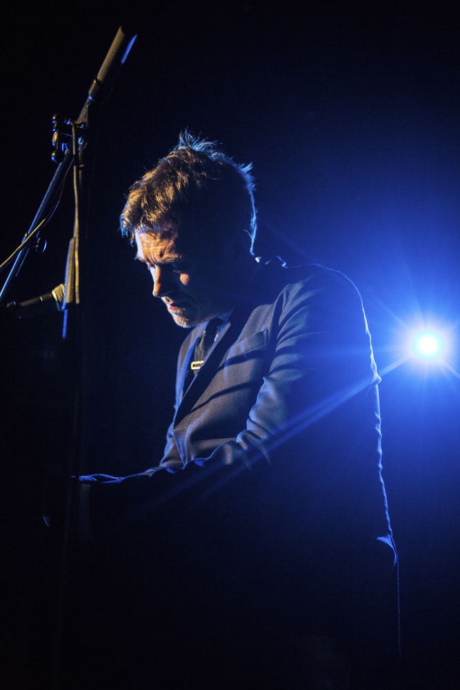 Damon Albarn - Portrayed Behind the Piano in a Dark Stage, England, 2014 Poster (1/4)