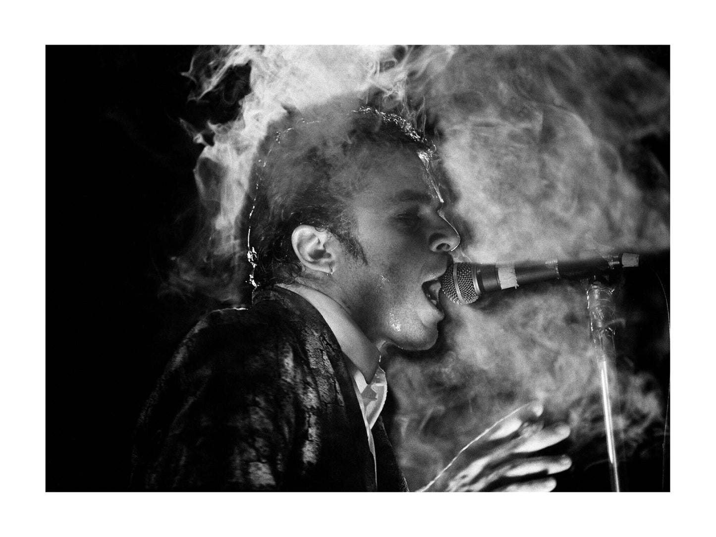 Ian Dury and the Blockheads - Ian Dury Smoking a Cigar on Stage, England, 1979 Print