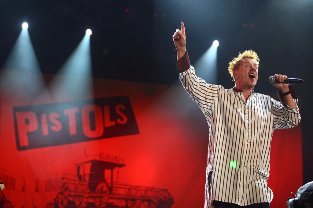Sex Pistols - John Lydon Singing on Stage with Banner Backdrop, England, 2008 Poster (1/6)