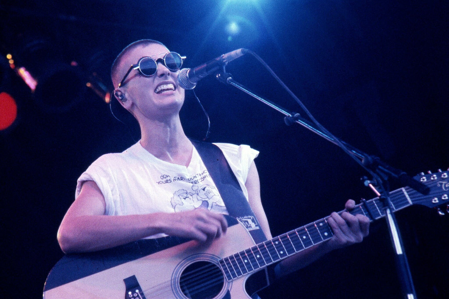 Sinead O'Connor - Playing Guitar and Singing on Stage, England, 1994 Poster